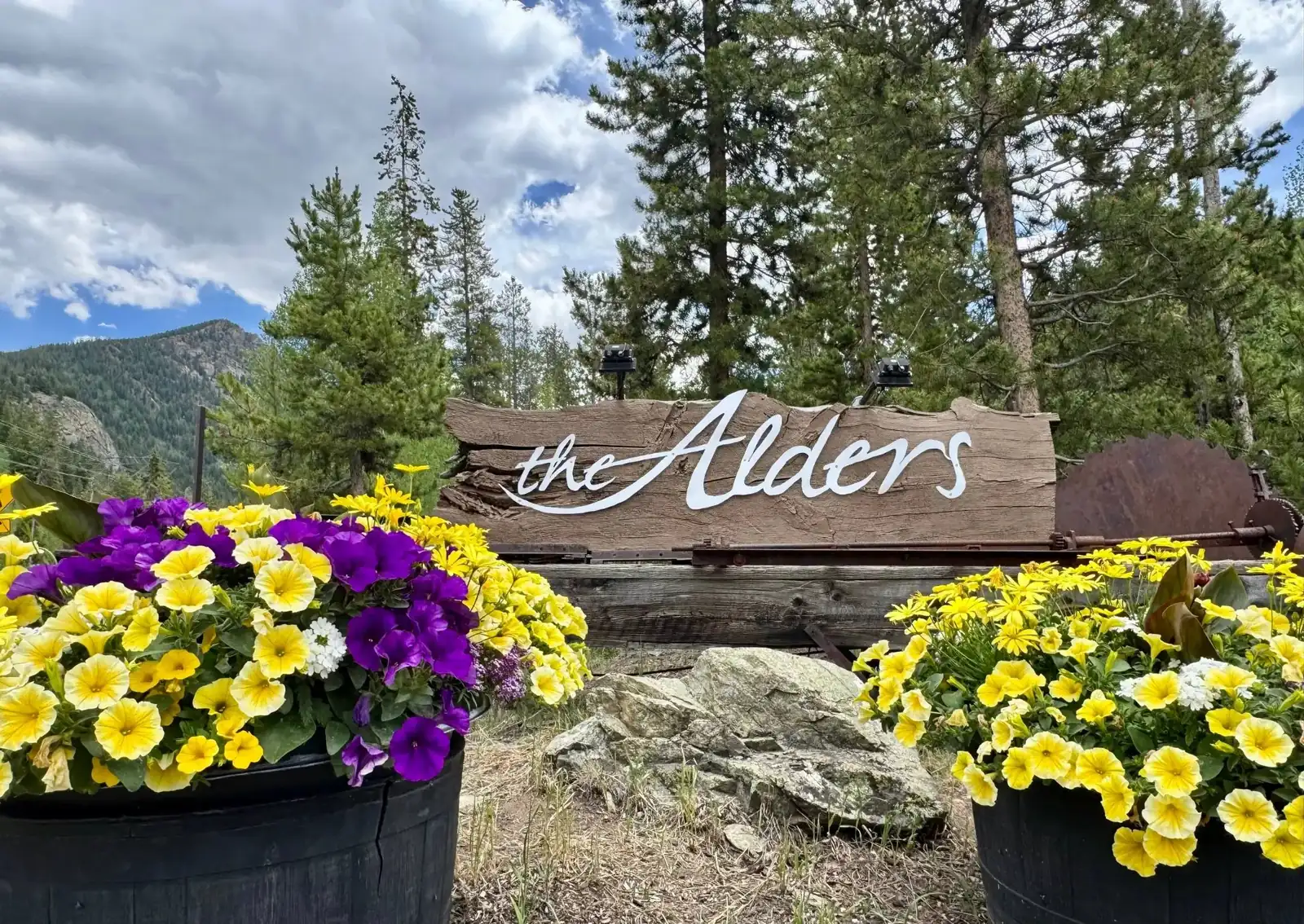 The Alders, the home wooden sign with summer flowers, luxury vacation rental in Keystone, Colorado