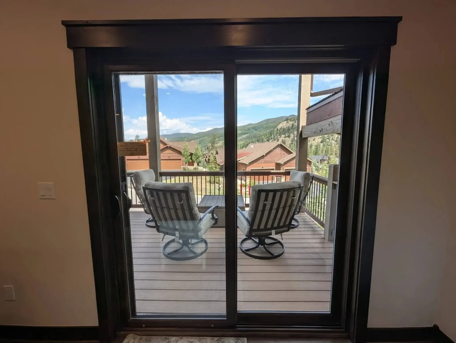 The Alders, Deck chairs and mountain view through sliding doors, luxury vacation rental in Keystone, Colorado