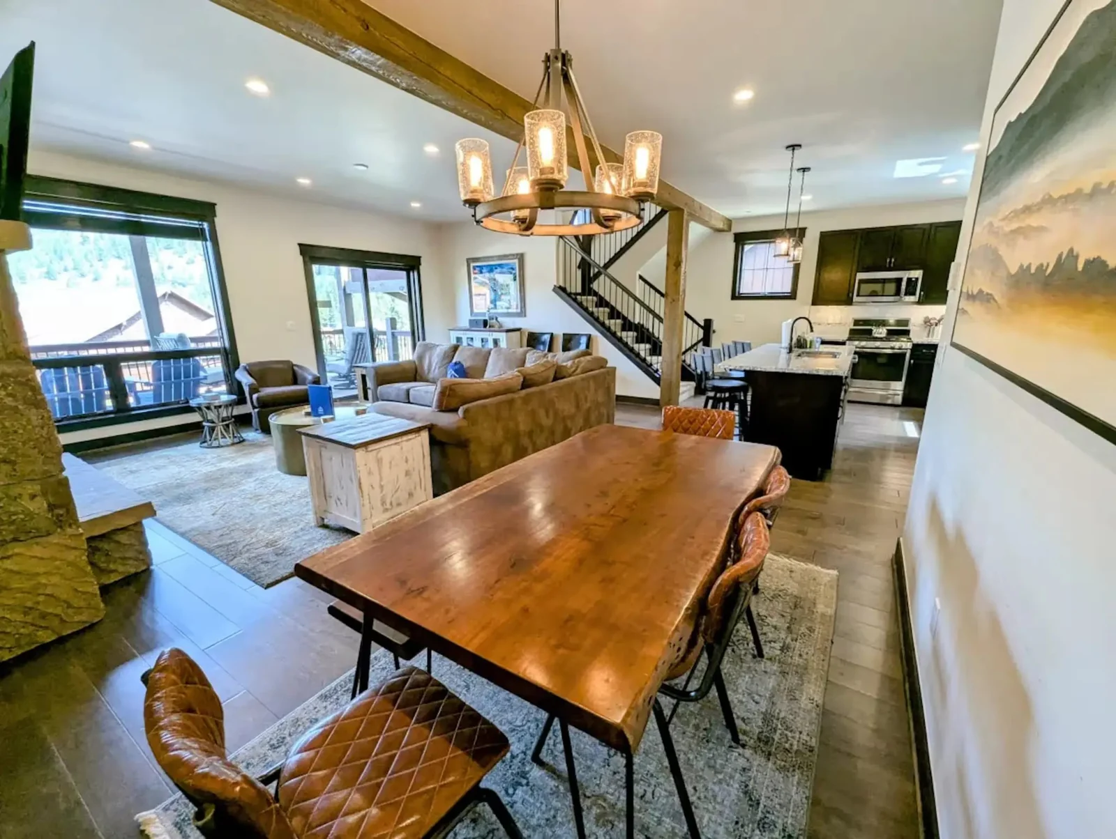 The Alders, Luxury dining table opening to the great room, luxury vacation rental in Keystone, Colorado