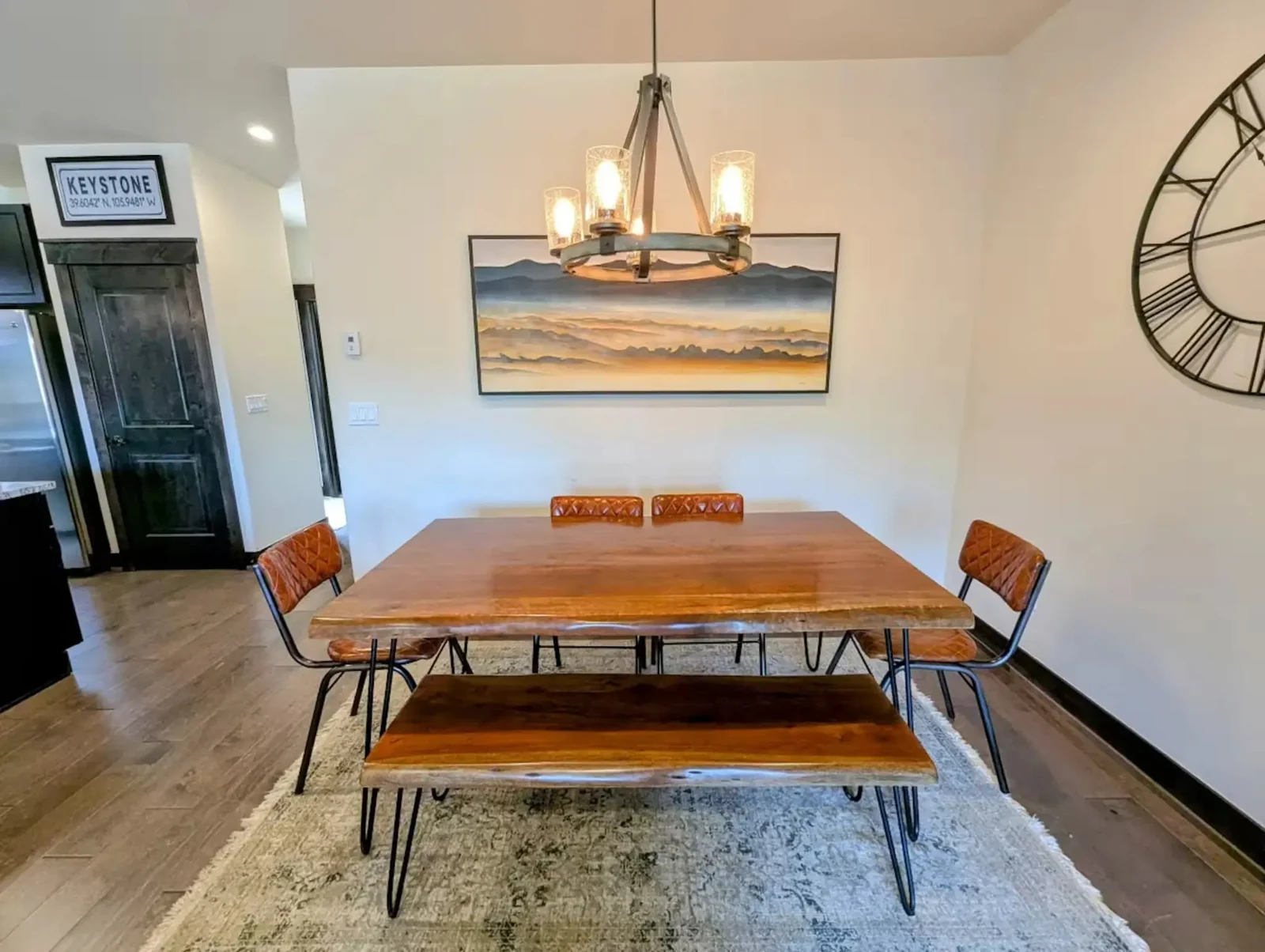 The Alders, Live-edge dining table with chandelier, luxury vacation rental in Keystone, Colorado