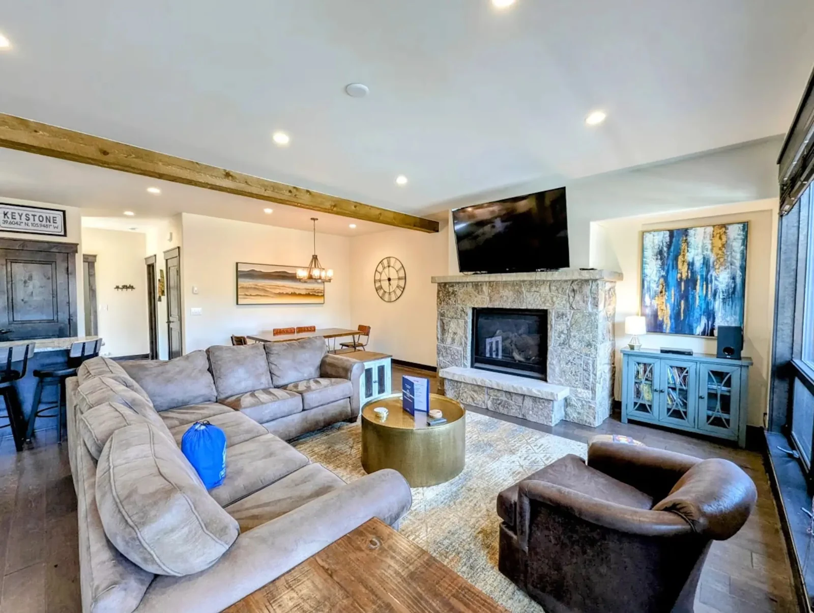The Alders, Deep sofas facing the stone fireplace, luxury vacation rental in Keystone, Colorado