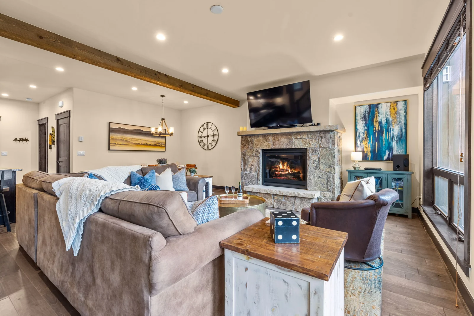 The Alders, Stone fireplace and plush seating in the living room, luxury vacation rental in Keystone, Colorado