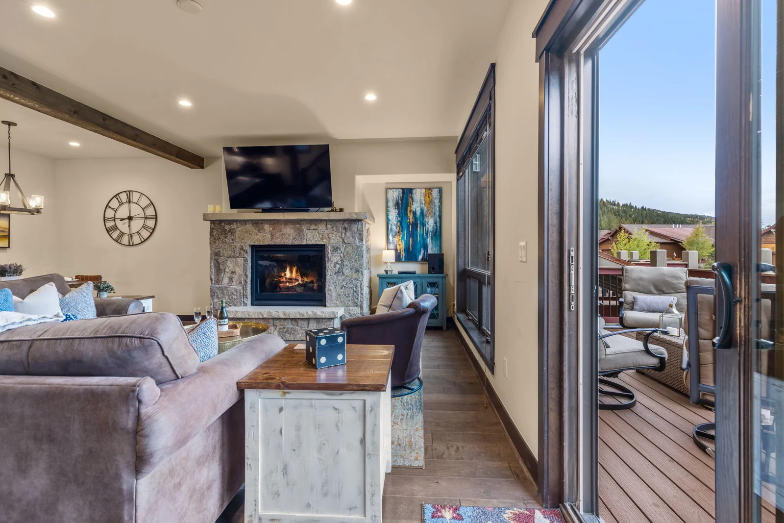 The Alders, Living room opening onto the furnished deck, luxury vacation rental in Keystone, Colorado