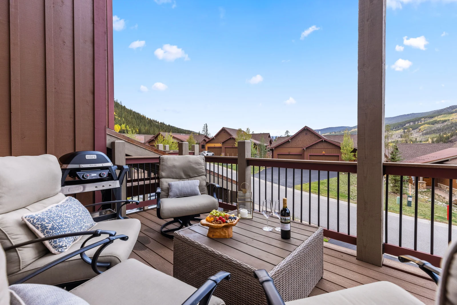 The Alders, Covered deck with lounge seating and mountain views, luxury vacation rental in Keystone, Colorado