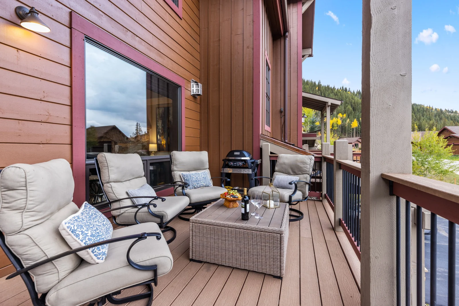 The Alders, Covered alpine deck with armchairs and grill, luxury vacation rental in Keystone, Colorado