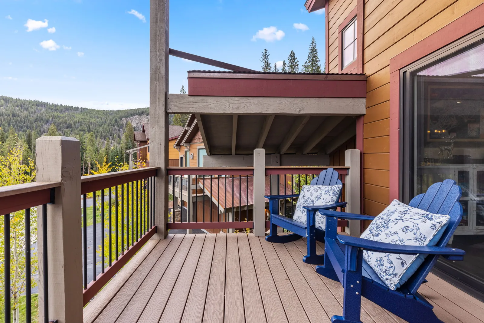 The Alders, Blue Adirondack chairs on the home balcony, luxury vacation rental in Keystone, Colorado