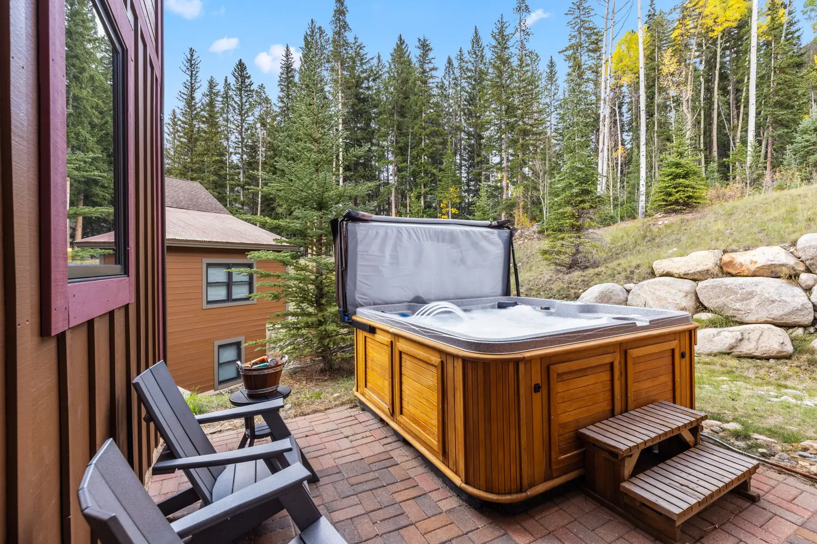 The Alders, Private outdoor hot tub on the deck with forest views, luxury vacation rental in Keystone, Colorado
