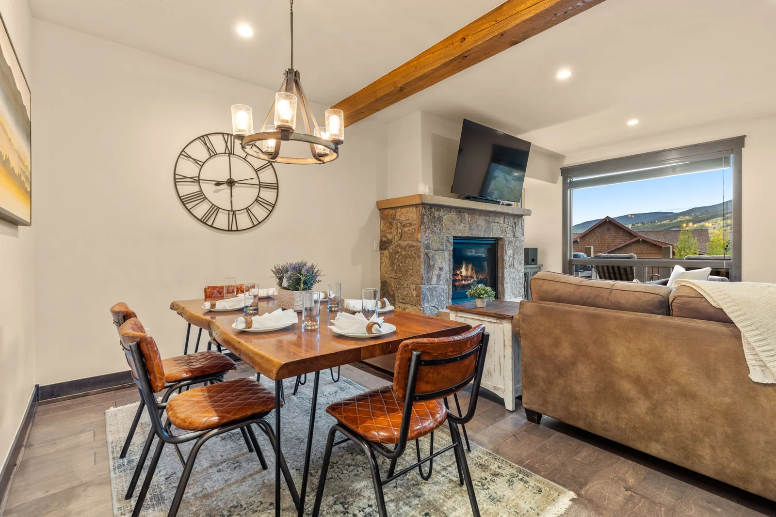 The Alders, Dining area beside the stone fireplace, luxury vacation rental in Keystone, Colorado