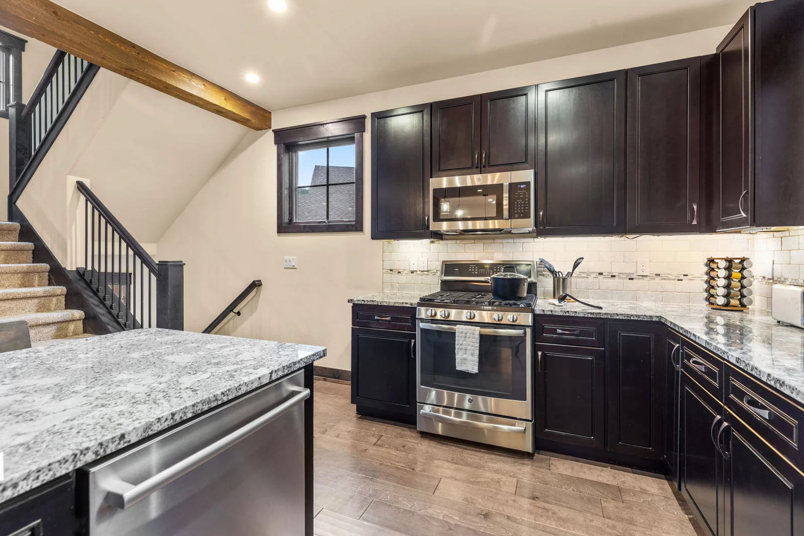 The Alders, Full kitchen with dark cabinetry and stainless range, luxury vacation rental in Keystone, Colorado