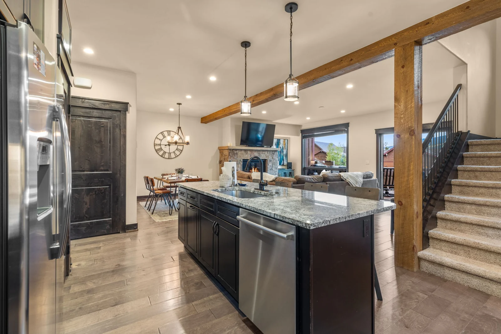 The Alders, Kitchen island overlooking living and dining spaces, luxury vacation rental in Keystone, Colorado