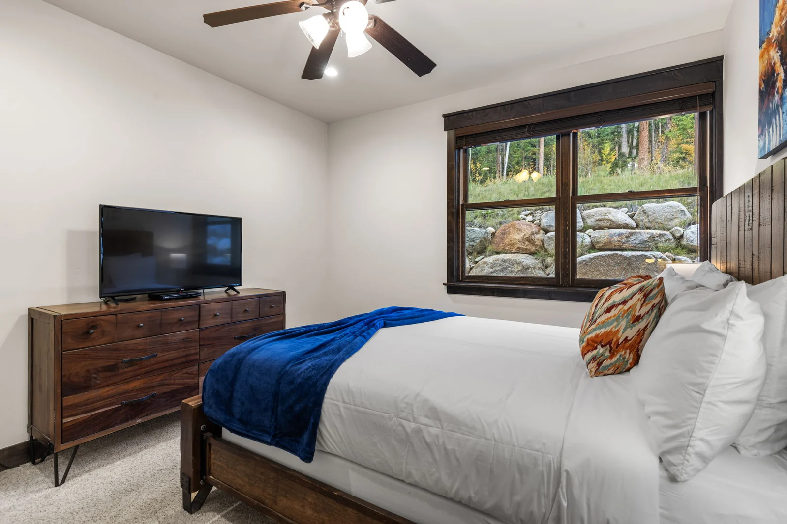 The Alders, Guest bedroom with television and woodland view, luxury vacation rental in Keystone, Colorado
