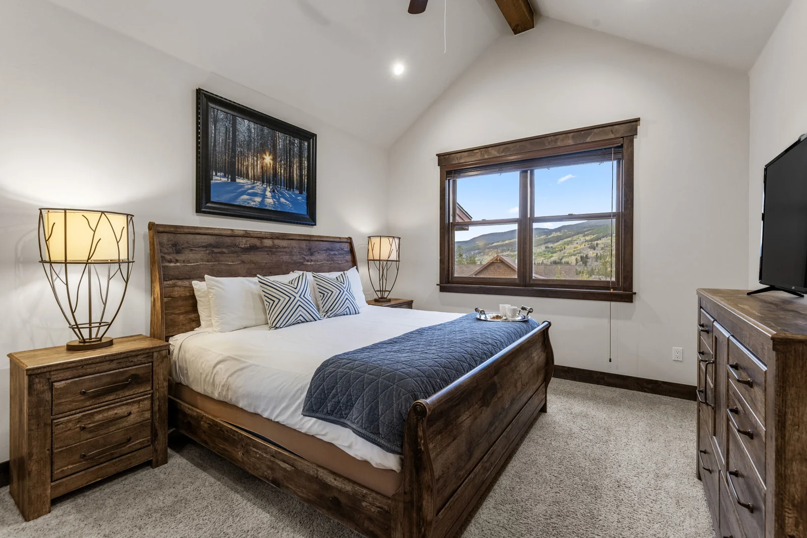 The Alders, Primary bedroom with mountain view and wood furnishings, luxury vacation rental in Keystone, Colorado