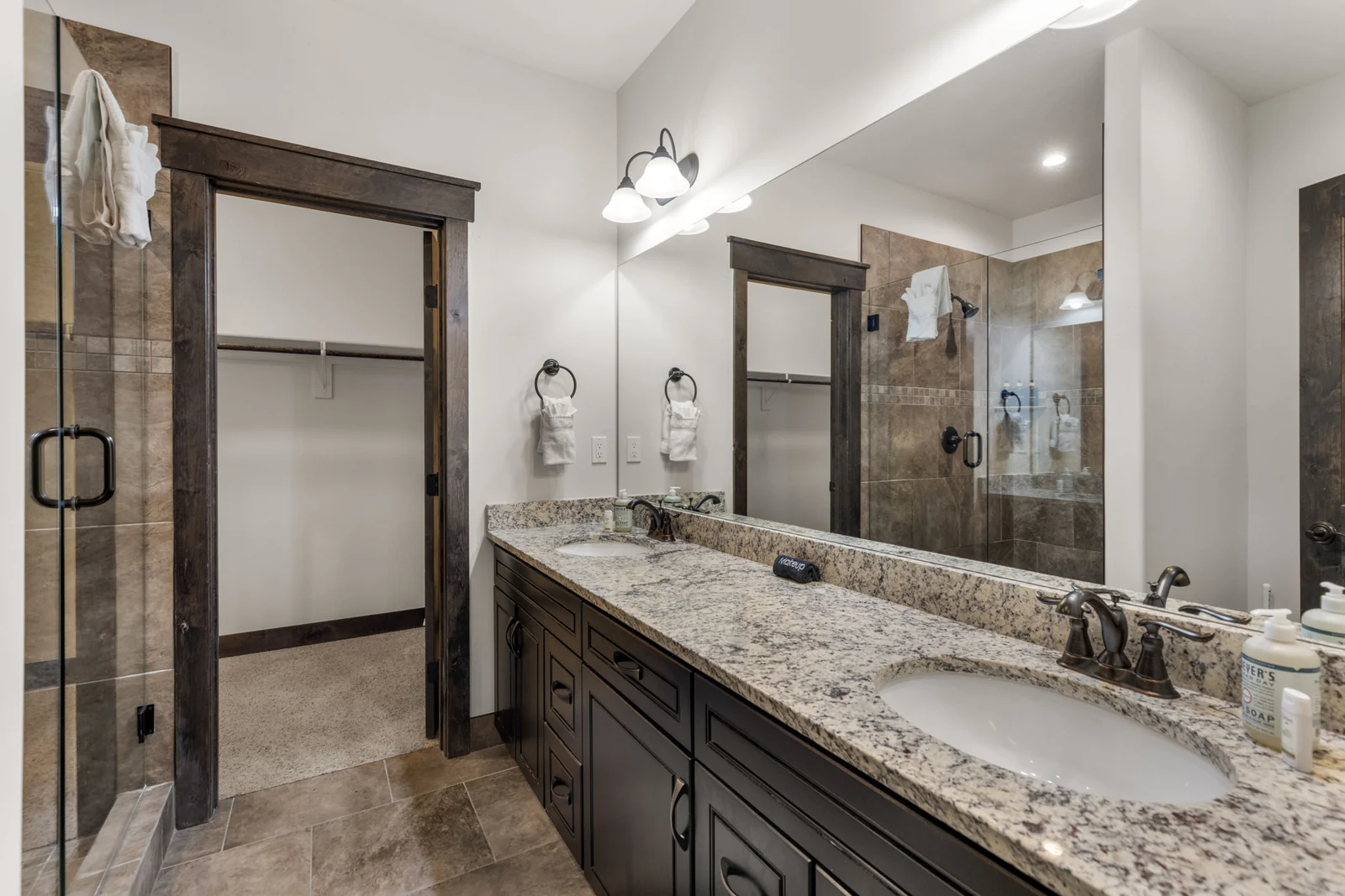 The Alders, Bathroom vanity with twin sinks and glass shower, luxury vacation rental in Keystone, Colorado