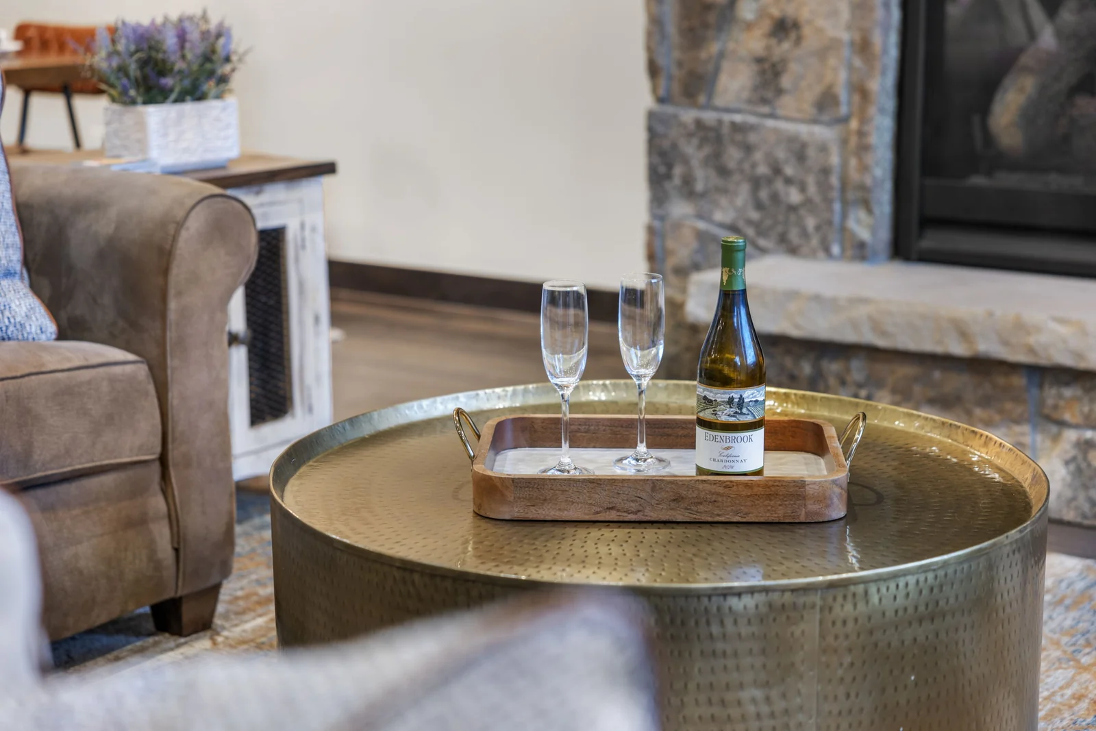 The Alders, Welcome drinks beside the stone fireplace, luxury vacation rental in Keystone, Colorado