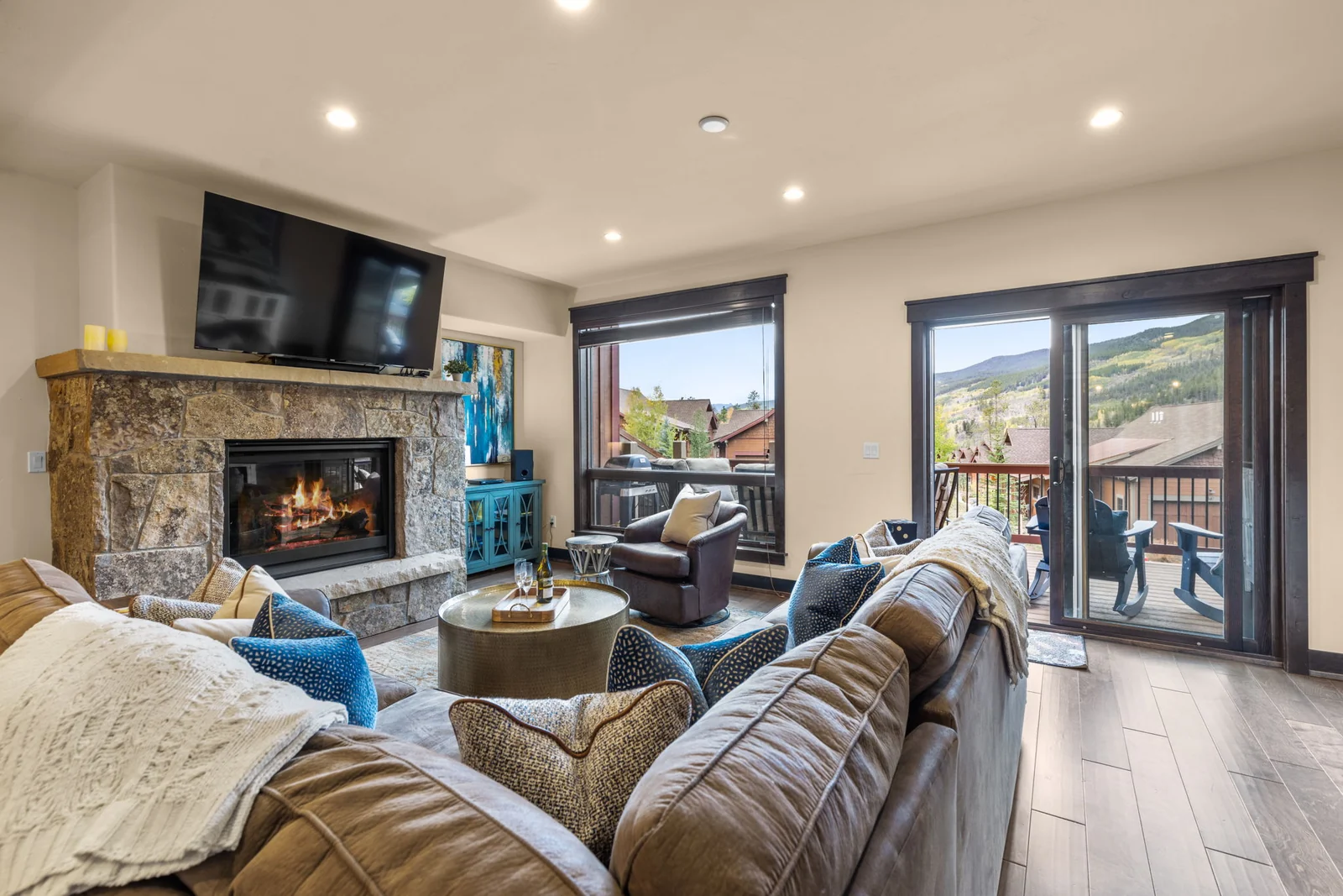 The Alders, Sofas and stone fireplace in the home great room, luxury vacation rental in Keystone, Colorado