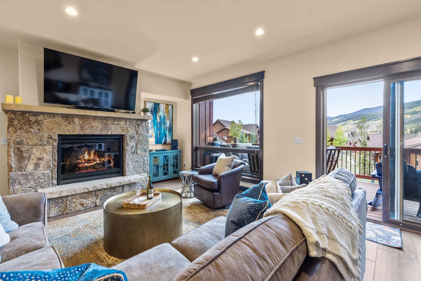 The Alders, Great room with fireplace and doors to the deck, luxury vacation rental in Keystone, Colorado