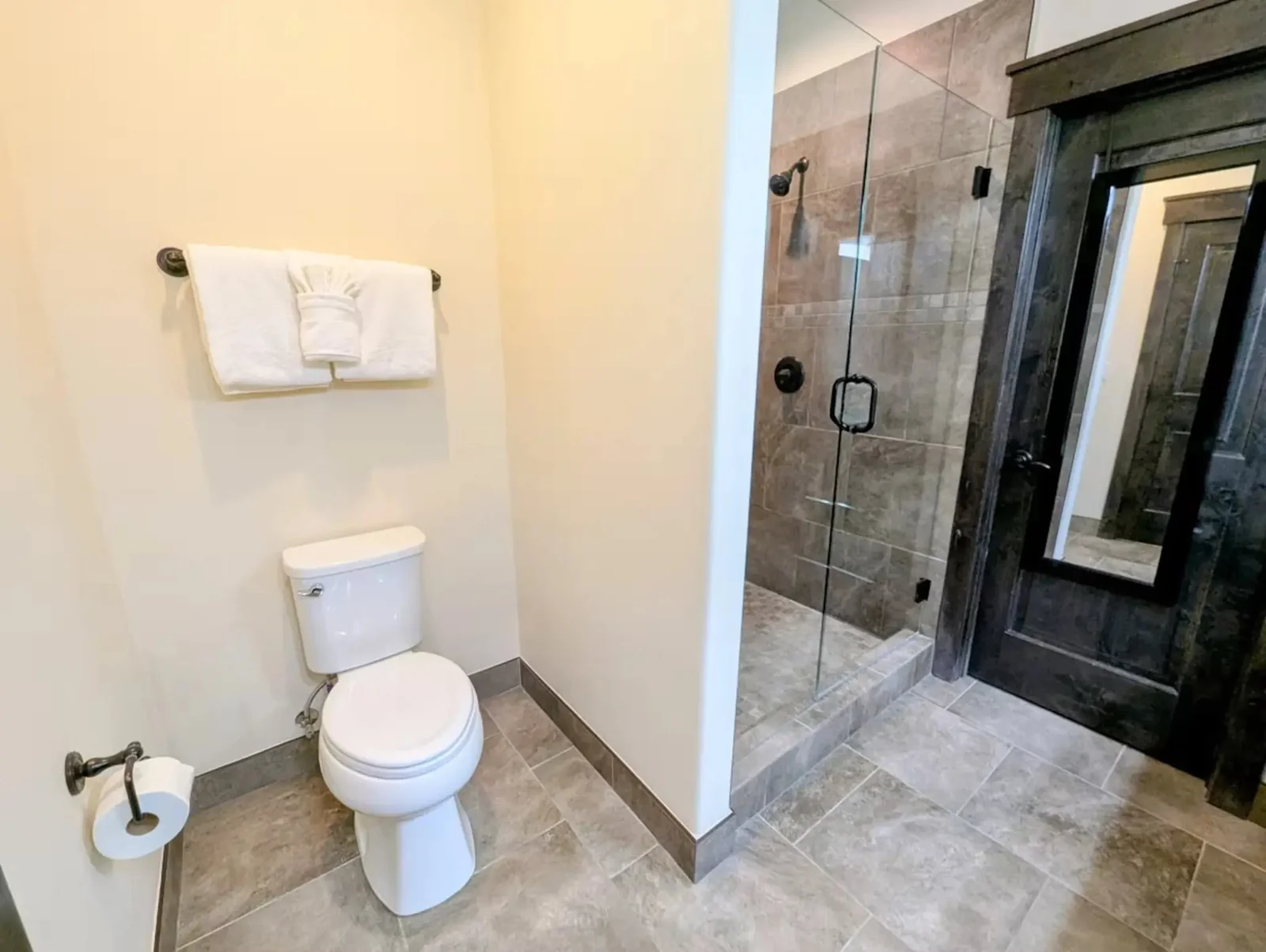 The Alders, Full ensuite bathroom with stone shower and toilet, luxury vacation rental in Keystone, Colorado